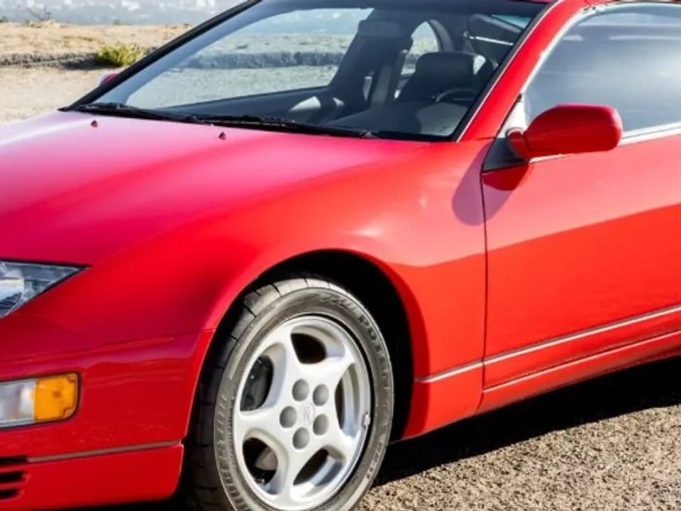 Zoomed driver-side front fender on a red 300ZX
